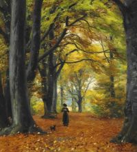 Brendekilde Hans Andersen 가을 숲에서 개를 산책시키는 젊은 여성 1910