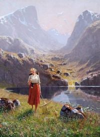 فتاة دال هانز بجانب بحيرة جبلية