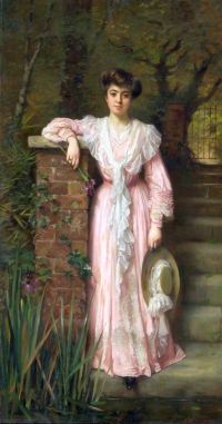 Kennington Thomas Benjamin Ein Porträt einer Dame in einem Garten, die ein rosa Kleid trägt, das eine Iris hält