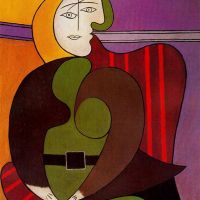 Picasso mujer sentada en un sillón rojo