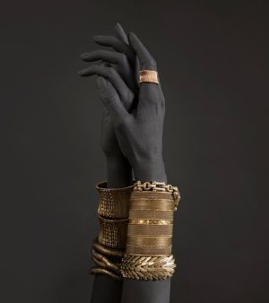 Elegance in Obsidian: A Golden Embrace wall art