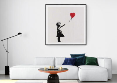 Contemporary living room with artwork of girl holding a heart-shaped balloon.