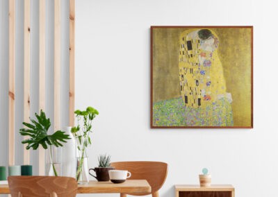 Gustav Klimt's "Kiss of Love" artwork displayed in a modern interior setting.