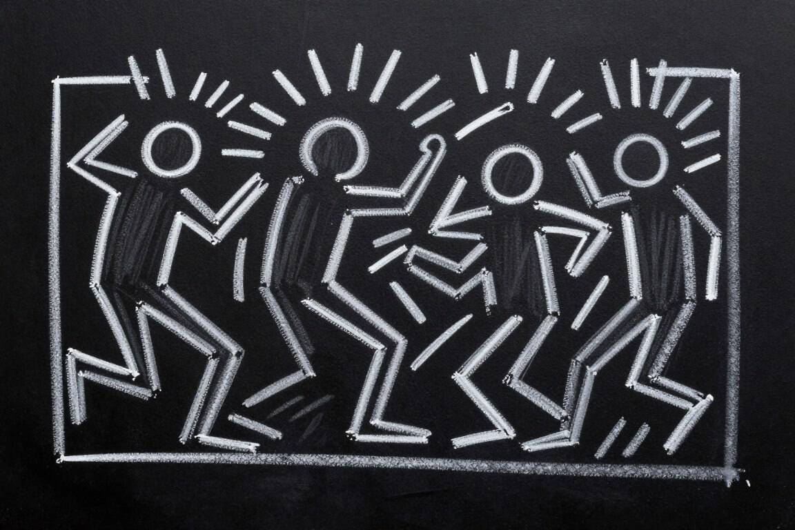 Modern Keith Haring-style dance figures in white chalk on black background.